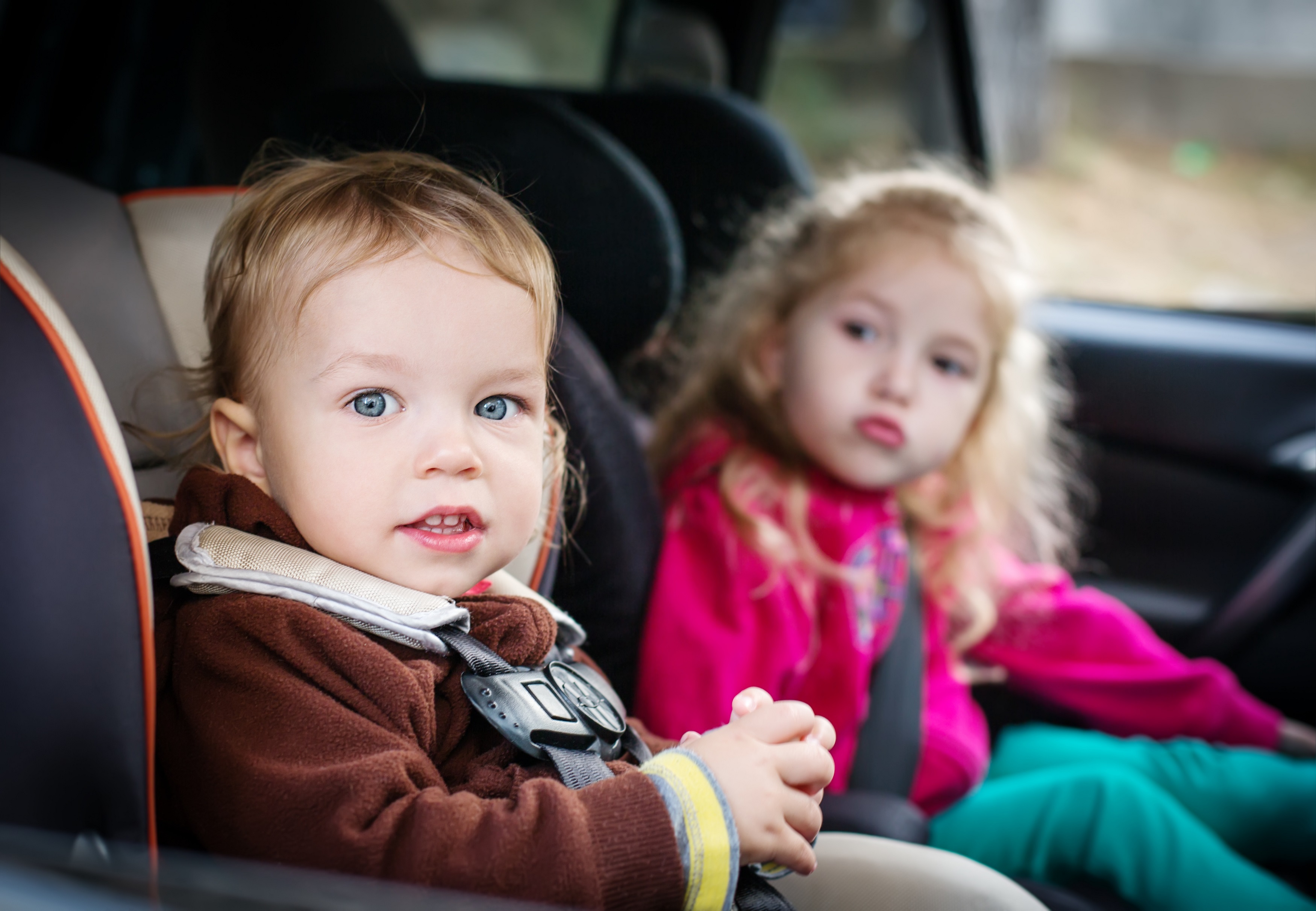 small children in car seats in the car Tad K. Morlan, Attorney at Law